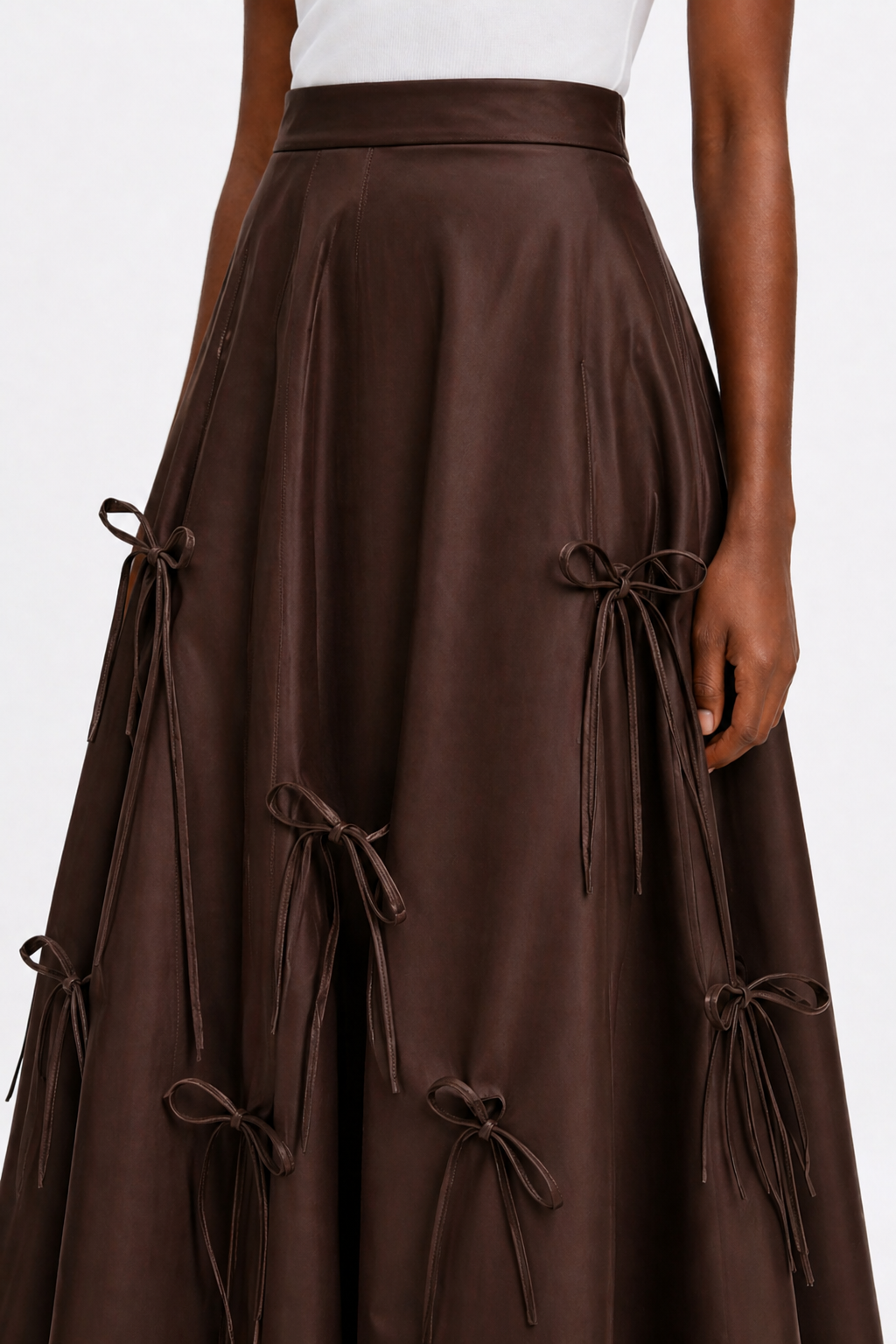 Brown skirt with tie details on a white background