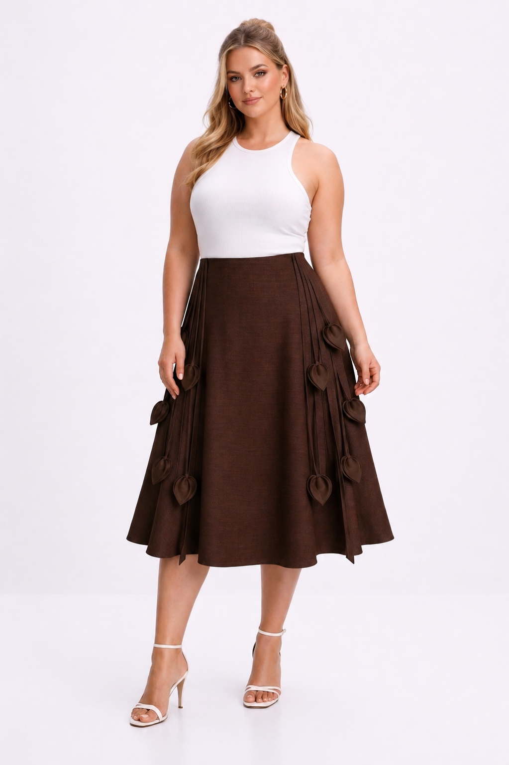 Woman wearing a white top and brown skirt on a white background