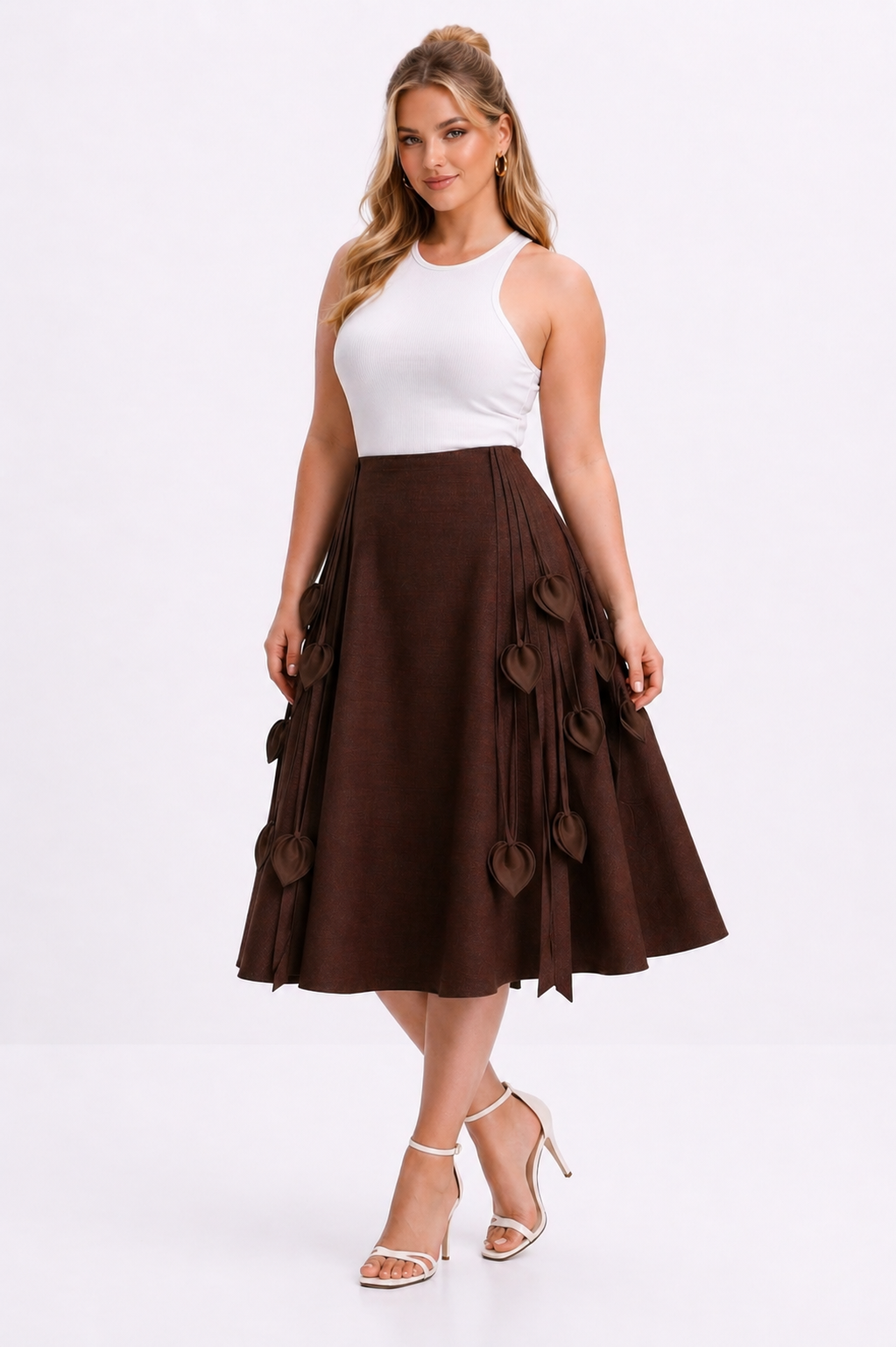 Woman wearing a white top and brown skirt on a white background