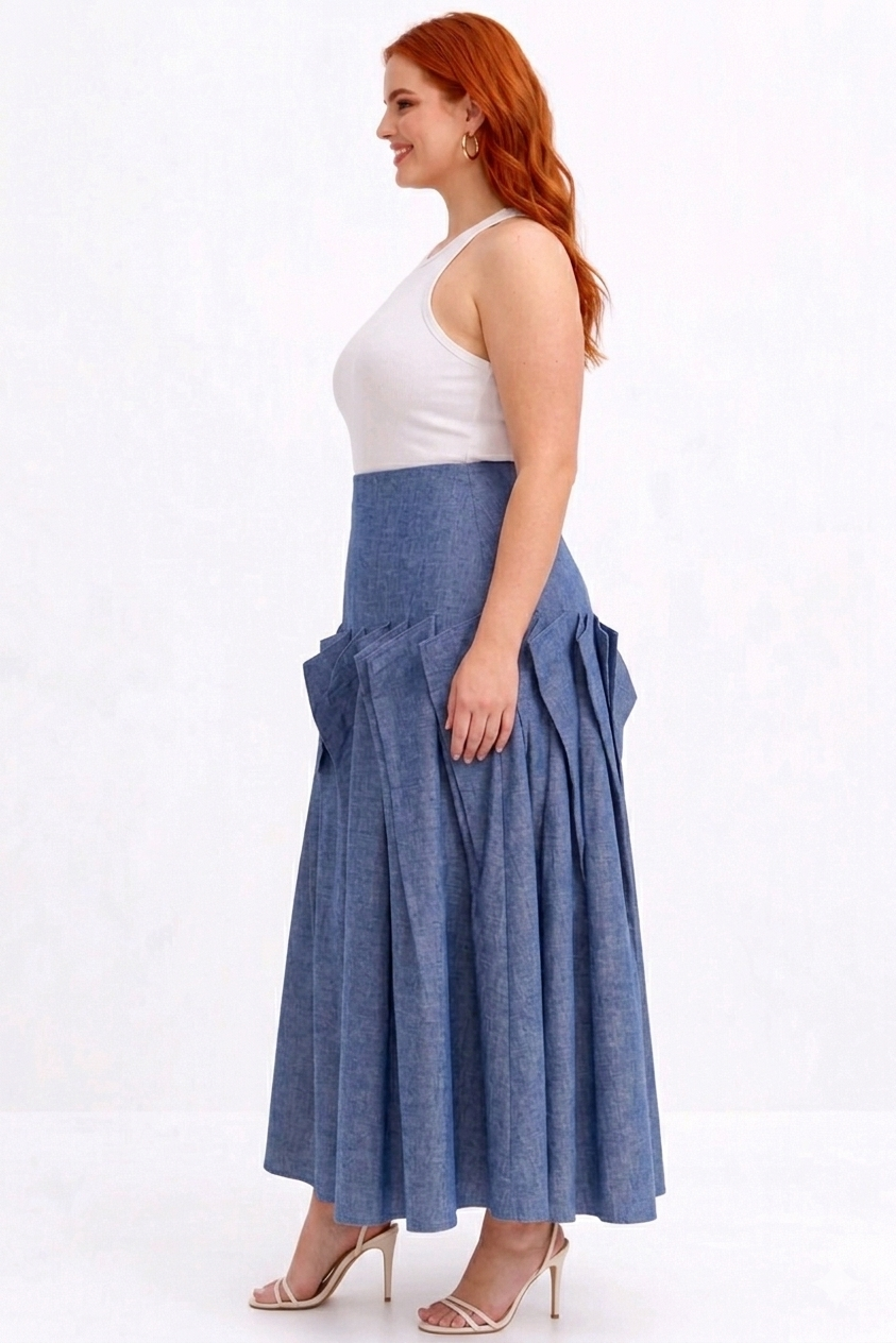 Woman wearing a white top and blue denim skirt on a white background